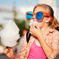 Girl eating cotton candy